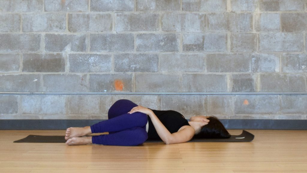 Yoga poses for low back pain relief - reclined twist - Argentina Rosado Yoga New York